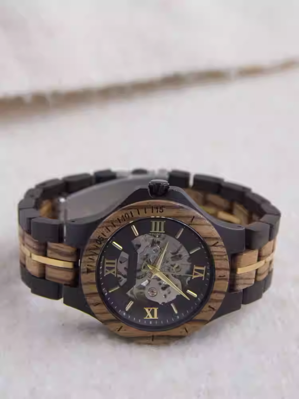 Black and gold transparent round skeletonized wooden men's automatic winding wooden watch with gold hands.